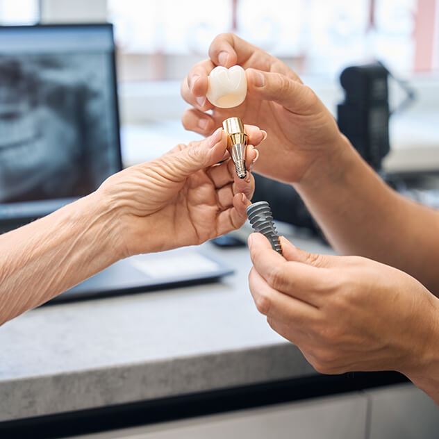 What makes Dr Bala Neel an expert in implants?